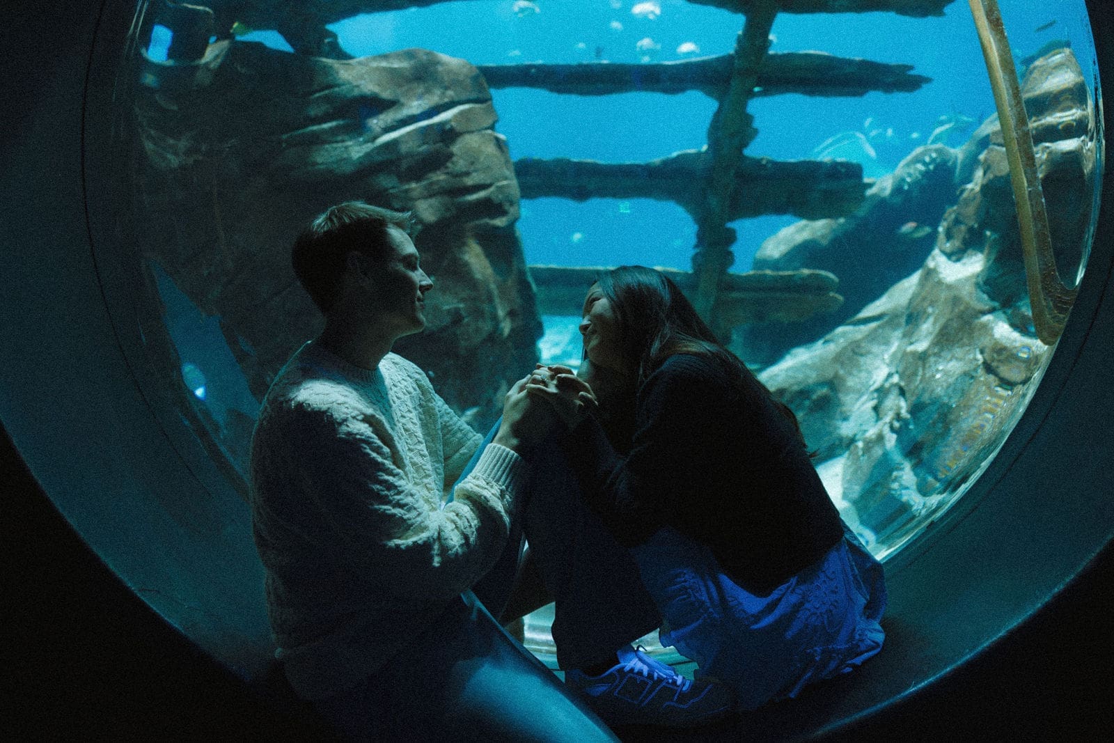 Atlanta engagement session at the Georgia Aquarium featuring a couple in a meaningful location chosen to reflect their relationship and story.