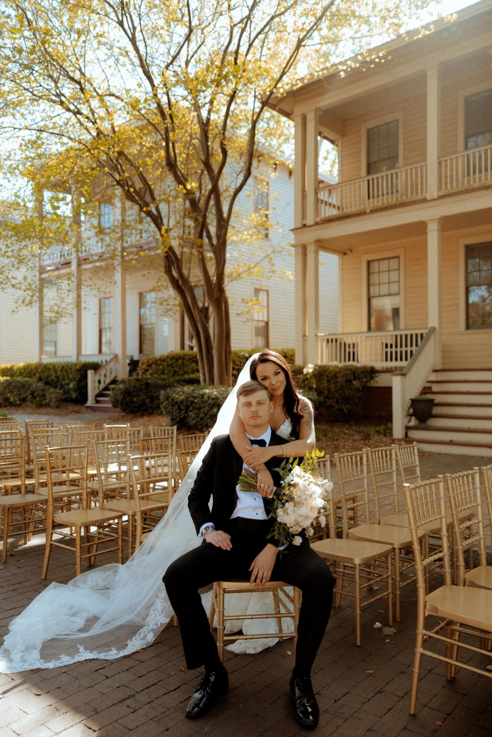 Bride and groom embracing during their wedding portraits at Fort Condé in downtown Mobile, Alabama.