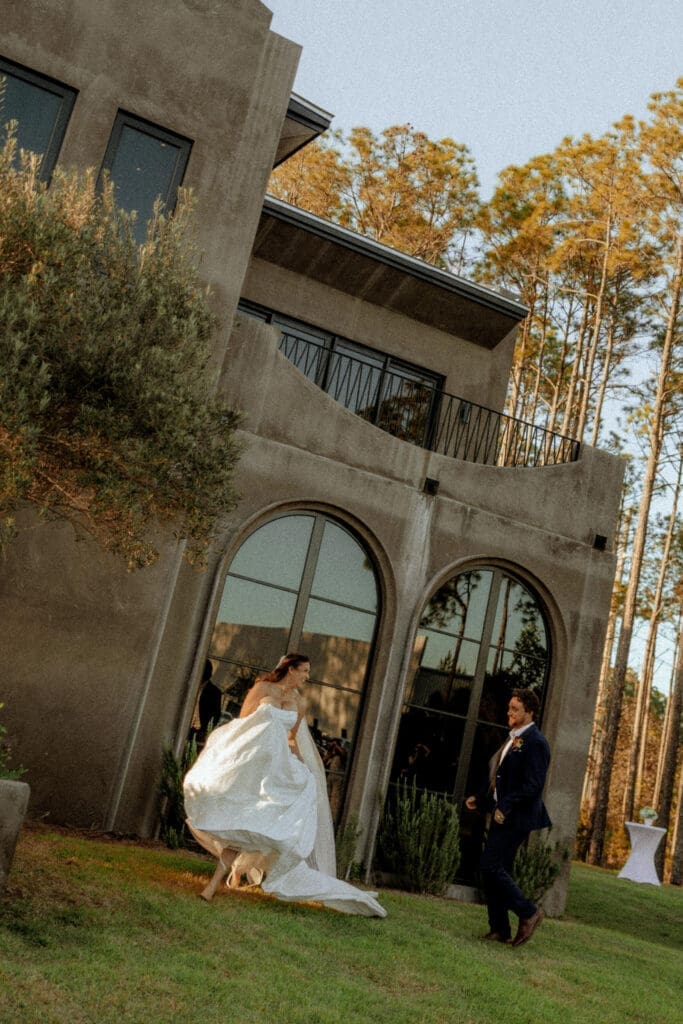 Bride and groom sharing a joyful first look outside their wedding venue in Destin, Florida.